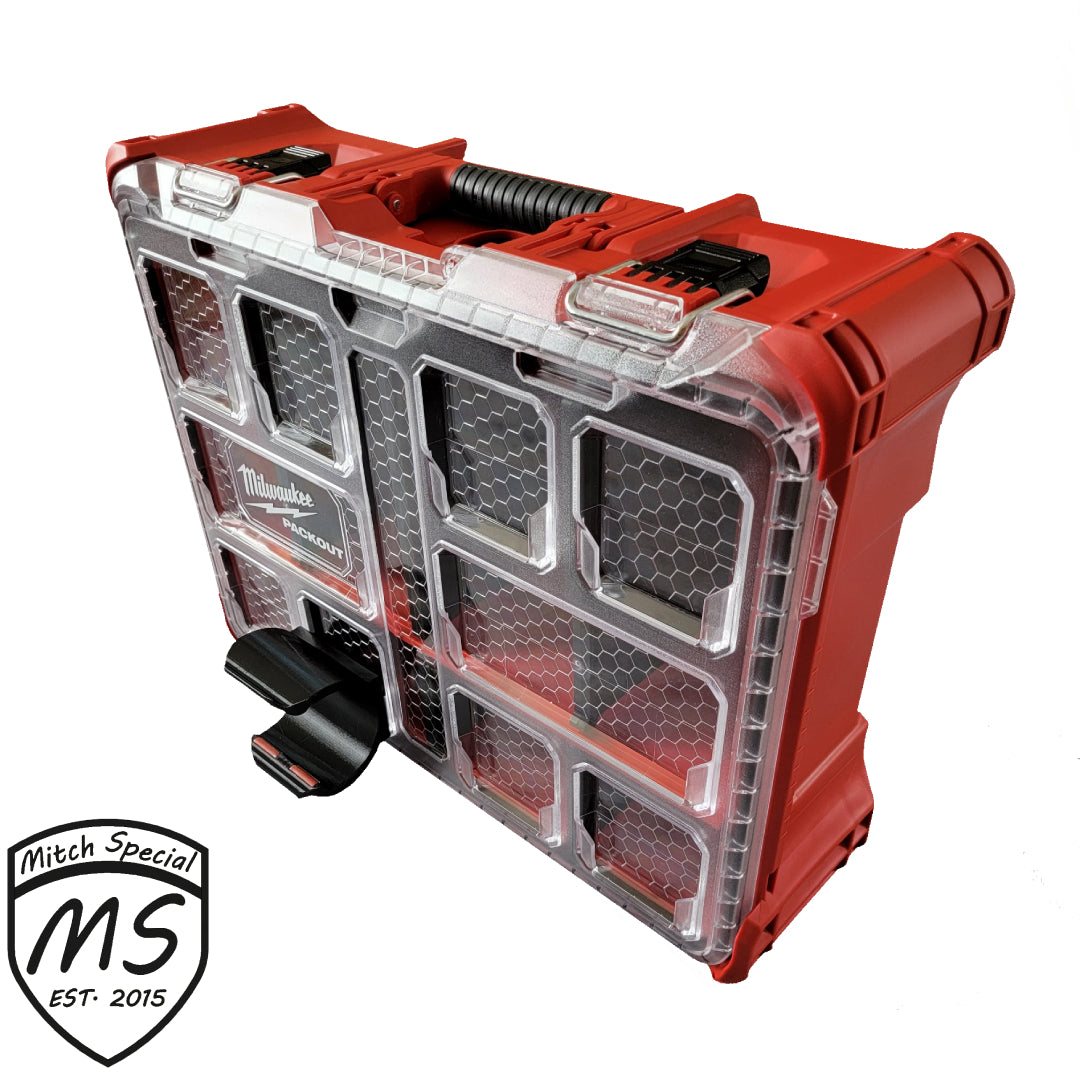 Black holder securely attached to a Milwaukee Packout case with clear compartments, perfect for organizing tools efficiently.