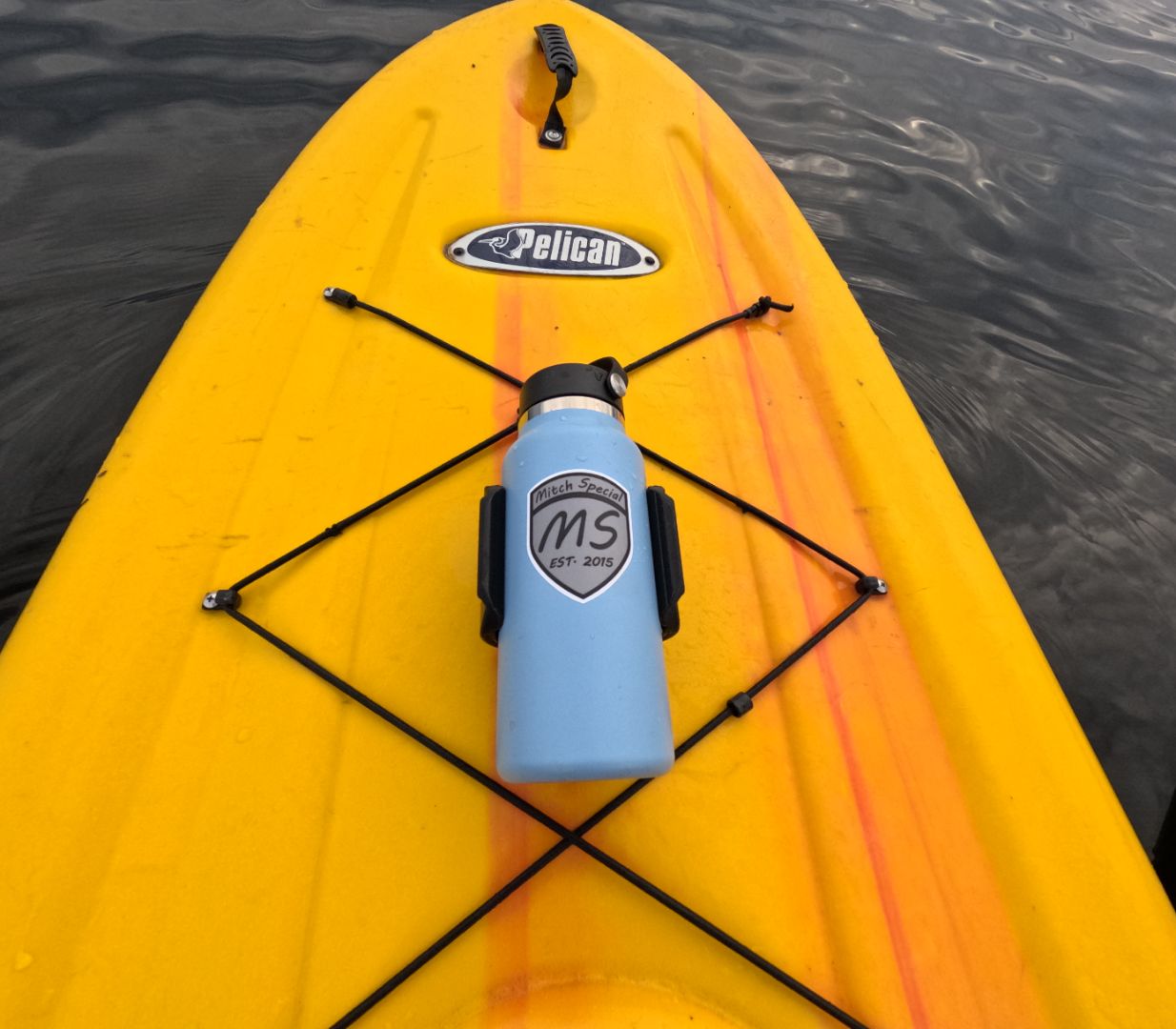 Blue water bottle holder on a yellow Pelican paddle board, secured with high-strength 3M VHB tape, ideal for stable hydration on the water.