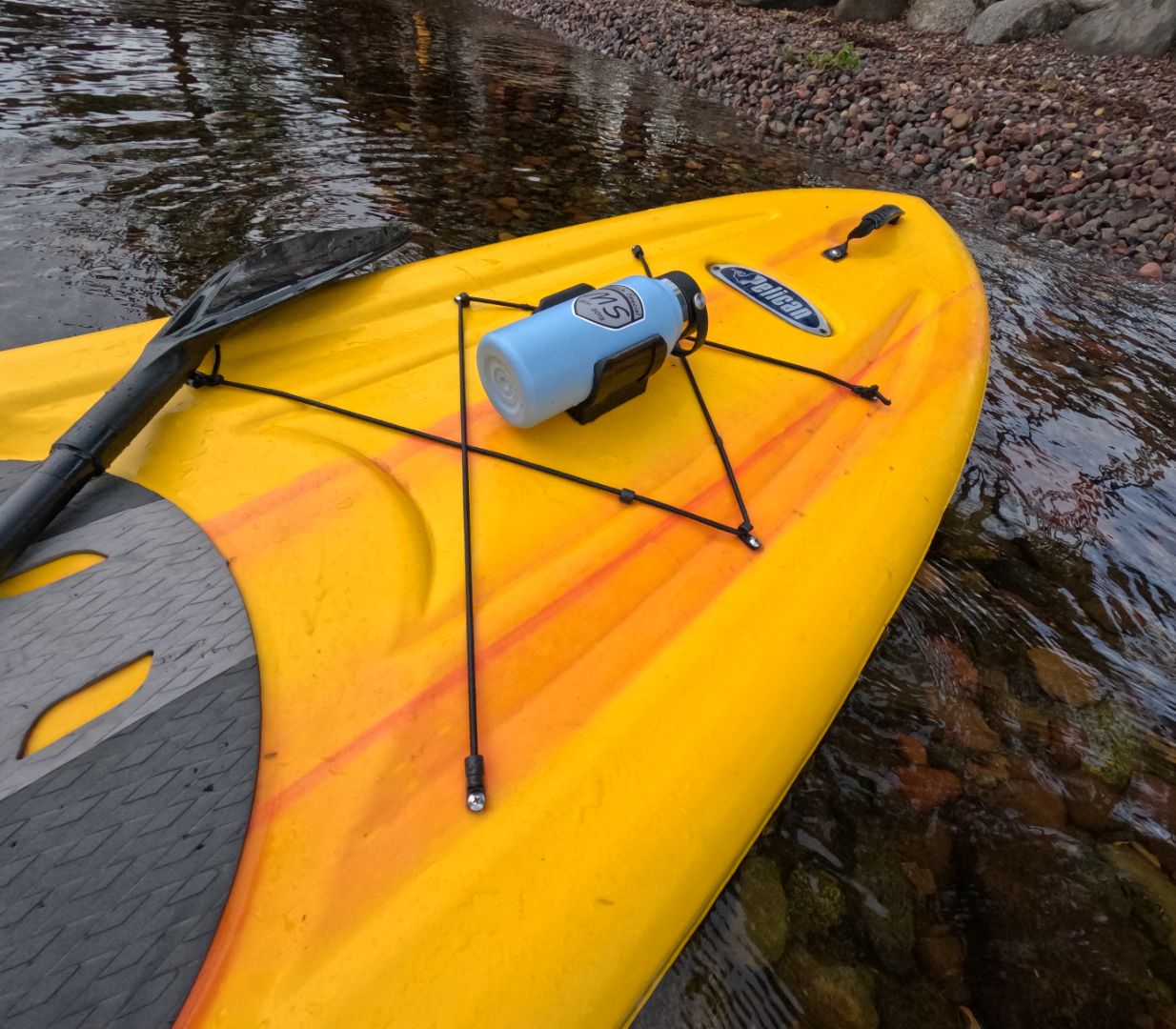 Water bottle holder on a yellow paddle board secured with high strength 3M VHB tape, showcasing its durability and convenience for paddlers.