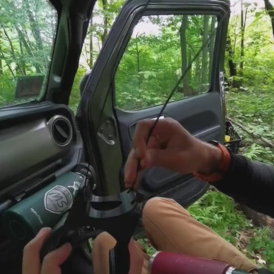 instructional video demonstrating the installation of Jeep JL roll bar water bottle holder, highlighting simple tools required, precise mounting points, and secure fit for rugged off-road use