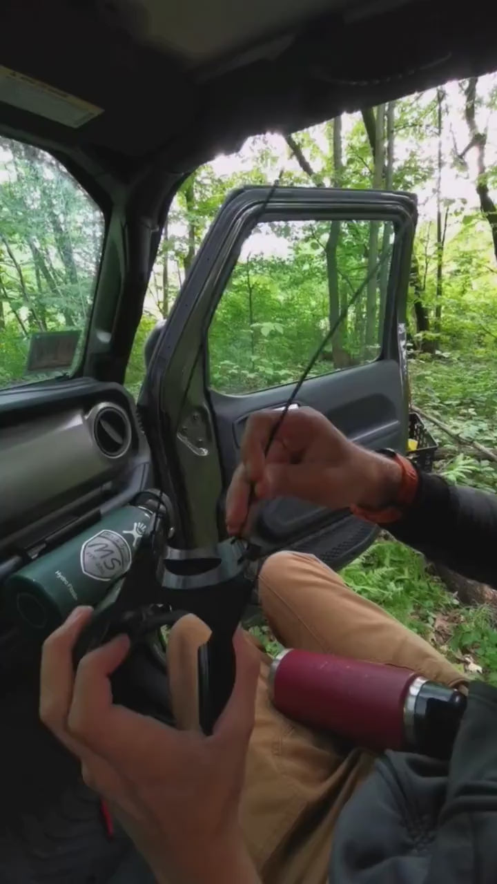 instructional video demonstrating the installation of Jeep JL roll bar water bottle holder, highlighting simple tools required, precise mounting points, and secure fit for rugged off-road use