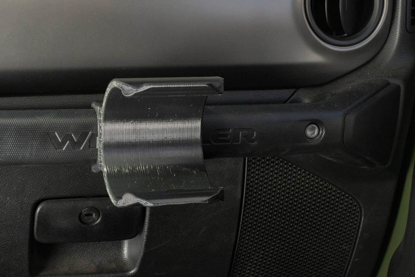 Angled view of Water Bottle Holder for Jeep JL mounted to grab handle.